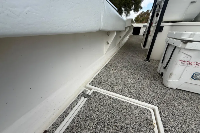 Slide: The Image of Interior view of 2022 Eastward 30 boat, featuring textured flooring and storage compartments. - 91