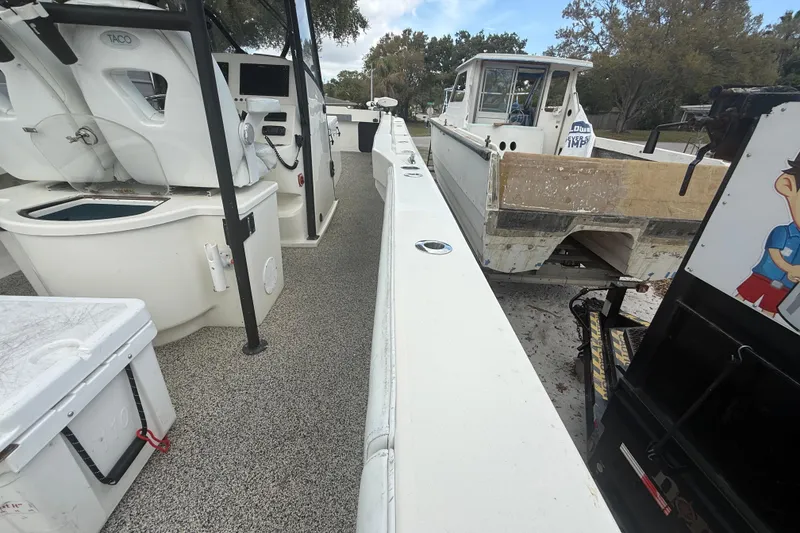 Slide: The Image of Interior view of a 2022 Eastward 30 boat, featuring seating and control panel. - 94