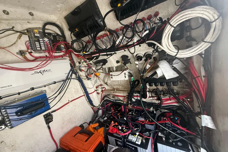 Slide: The Image of Electrical wiring and components inside a 2022 Eastward 30 boat. - 99