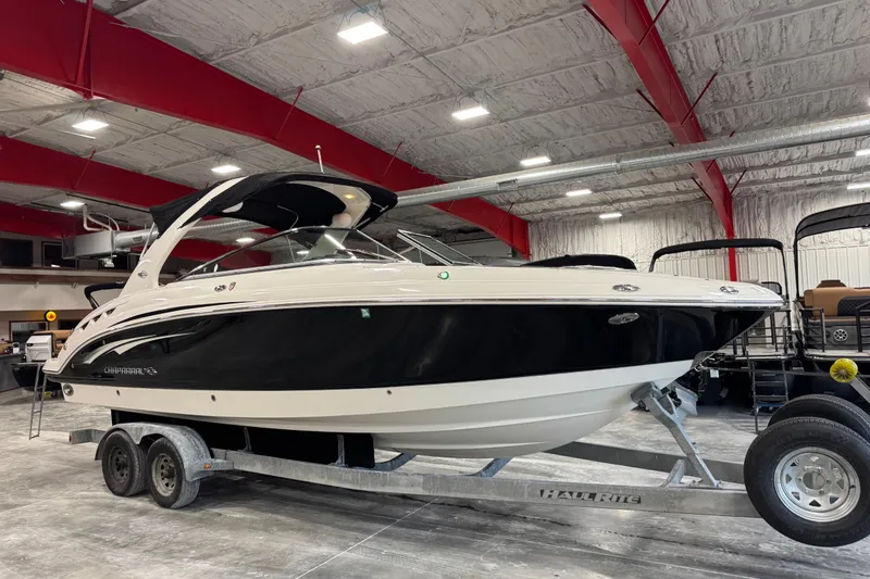 The Image of 2014 Chaparral 287 SSX boat on trailer in indoor showroom. - 1