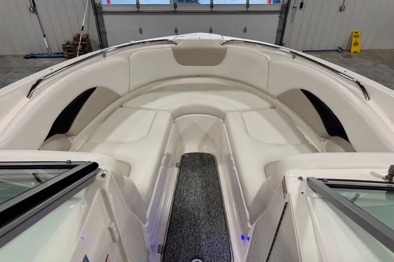Slide: The Image of 2014 Chaparral 287 SSX boat interior with white seating and stainless steel railings. - 12