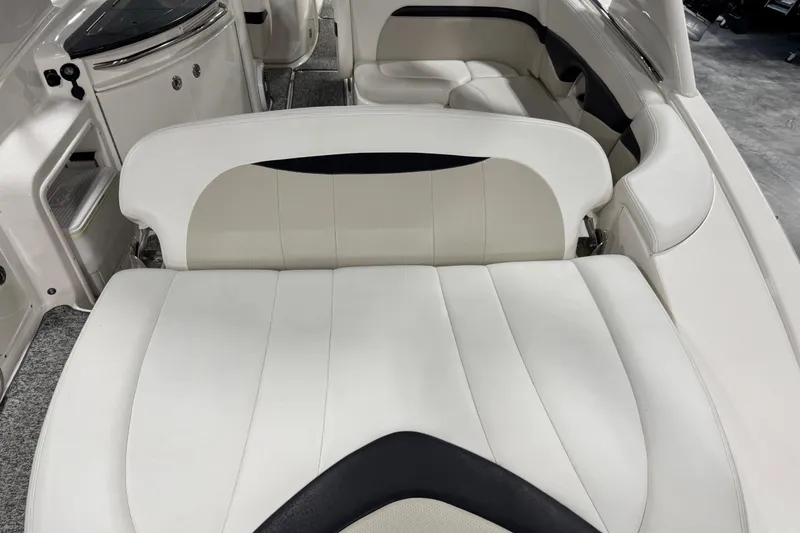 Slide: The Image of 2014 Chaparral 287 SSX boat interior with white leather seating and modern design. - 13