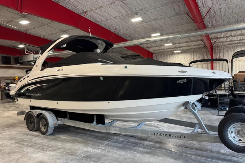 Slide: The Image of 2014 Chaparral 287 SSX boat on trailer in indoor storage facility. - 15