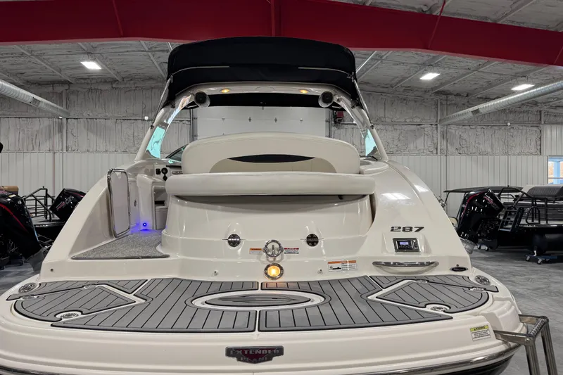 Slide: The Image of 2014 Chaparral 287 SSX boat in indoor showroom, rear view. - 5