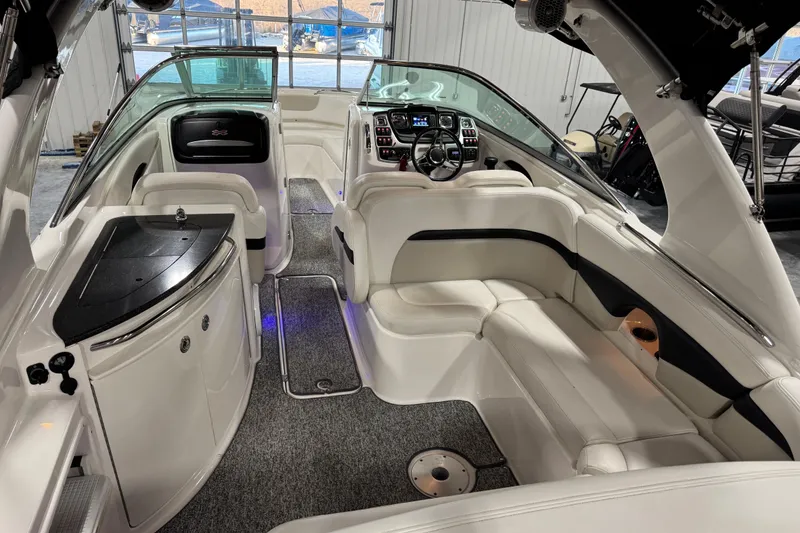 Slide: The Image of 2014 Chaparral 287 SSX boat interior with luxurious seating and modern dashboard. - 6