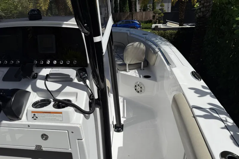 Slide: The Image of 2021 P Open 232 Center Console boat interior with control panel and seating. - 21