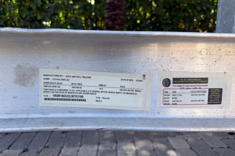 Slide: The Image of Trailer information label with specifications and safety standards, manufactured by Rock and Roll Trailers. - 33