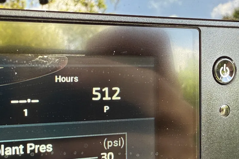 Slide: The Image of Display showing 512 hours on a 2021 P Open 232 Center Console. - 34