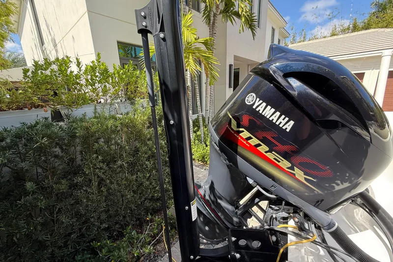 Slide: The Image of 2021 P Open 232 Center Console with Yamaha VMAX engine, outdoor setting. - 4