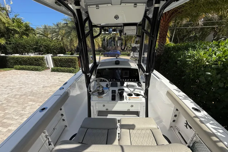 Slide: The Image of 2021 P Open 232 Center Console boat interior with steering wheel and seating. - 7