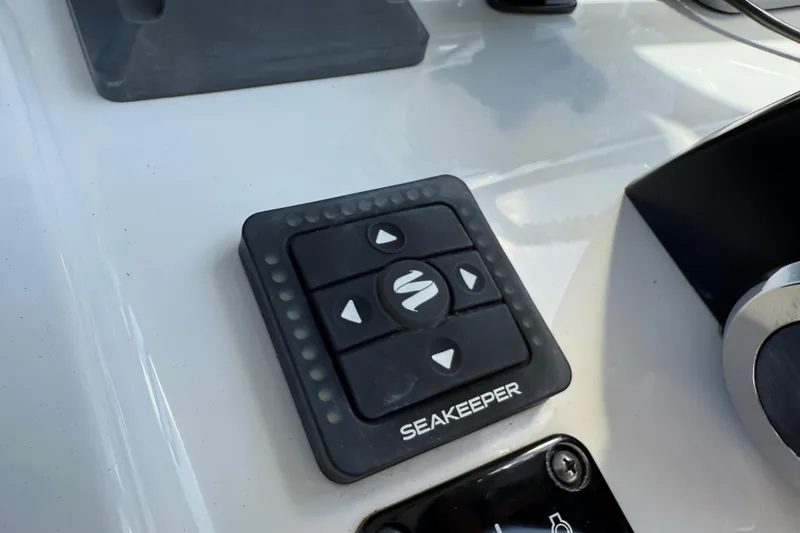 Slide: The Image of Control panel of a 2021 P Open 232 Center Console boat with Seakeeper system. - 9