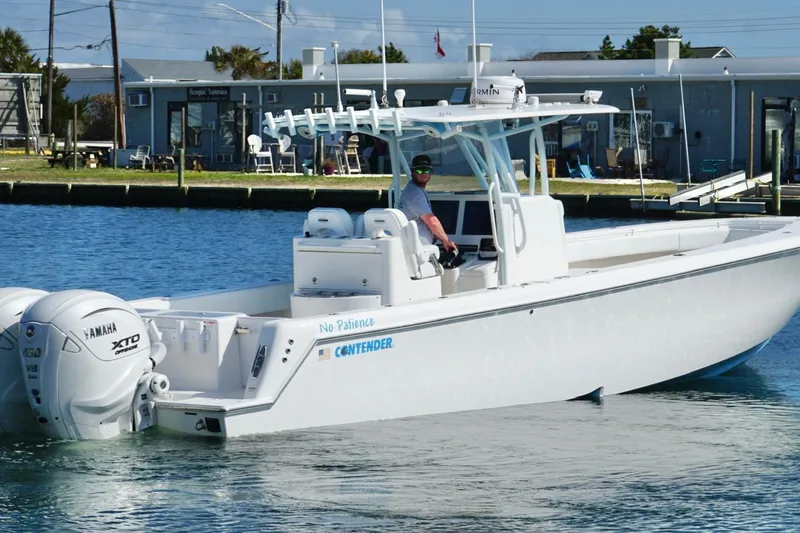 Slide: The Image of 2020 Contender 35 ST boat with Yamaha engines on calm water. - 1