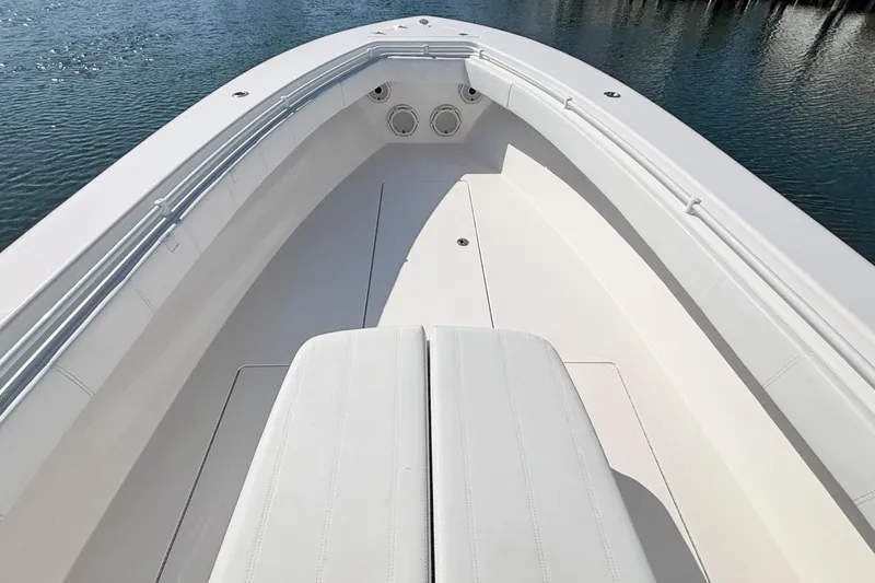 Slide: The Image of 2020 Contender 35 ST boat interior with sleek white seating and spacious deck. - 11