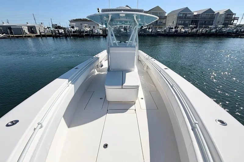 Slide: The Image of 2020 Contender 35 ST boat on water, showcasing sleek design and spacious deck. - 17