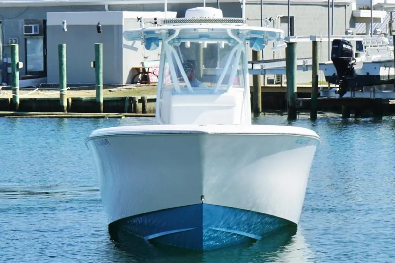 Slide: The Image of 2020 Contender 35 ST boat docked in marina, front view. - 4