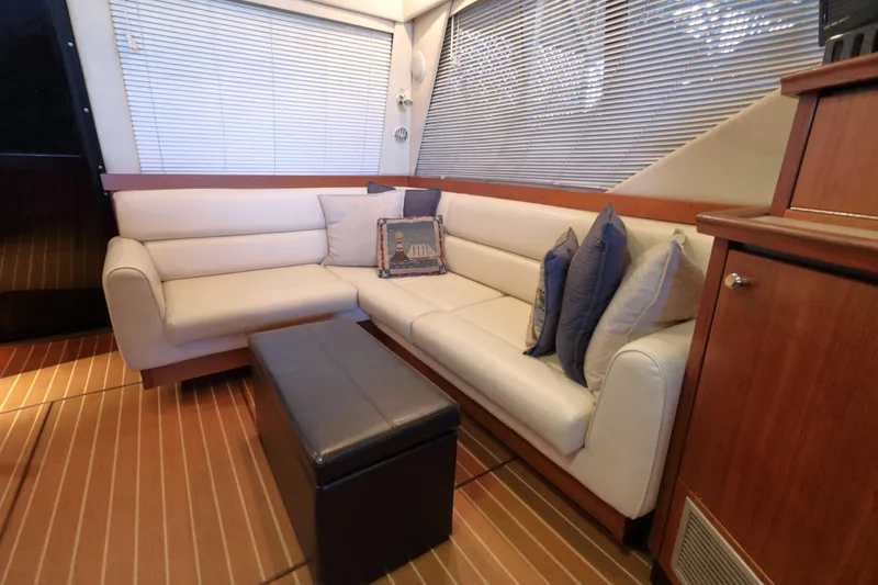 Slide: The Image of Luxurious interior of 1995 Bayliner 3988 Command Bridge Motoryacht with plush seating and elegant decor. - 10