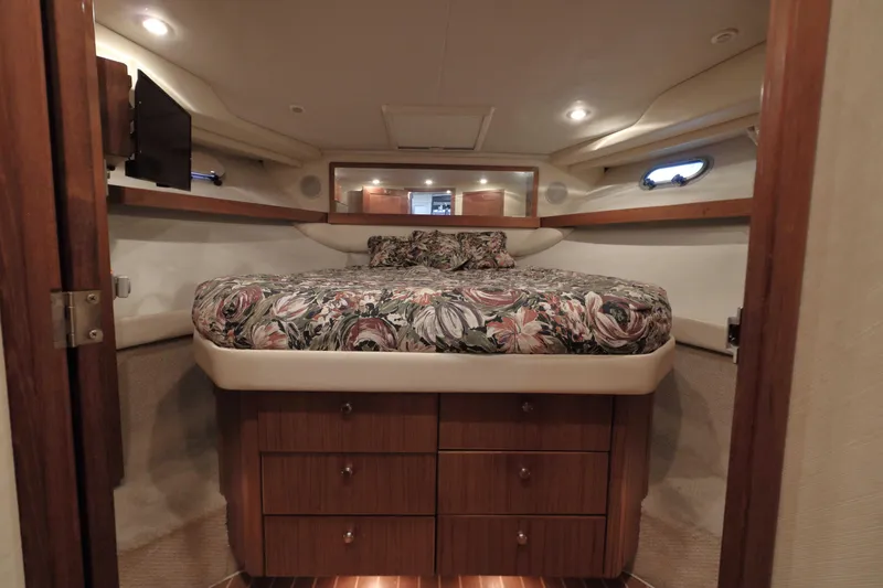 Slide: The Image of Luxurious bedroom interior of 1995 Bayliner 3988 Command Bridge Motoryacht with floral bedding. - 16