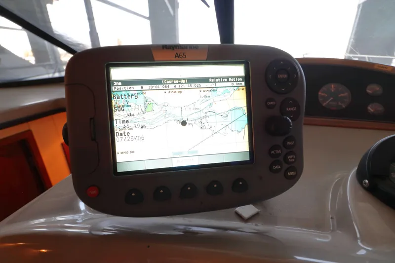 Slide: The Image of Navigation system on 1995 Bayliner 3988 Command Bridge Motoryacht dashboard. - 24