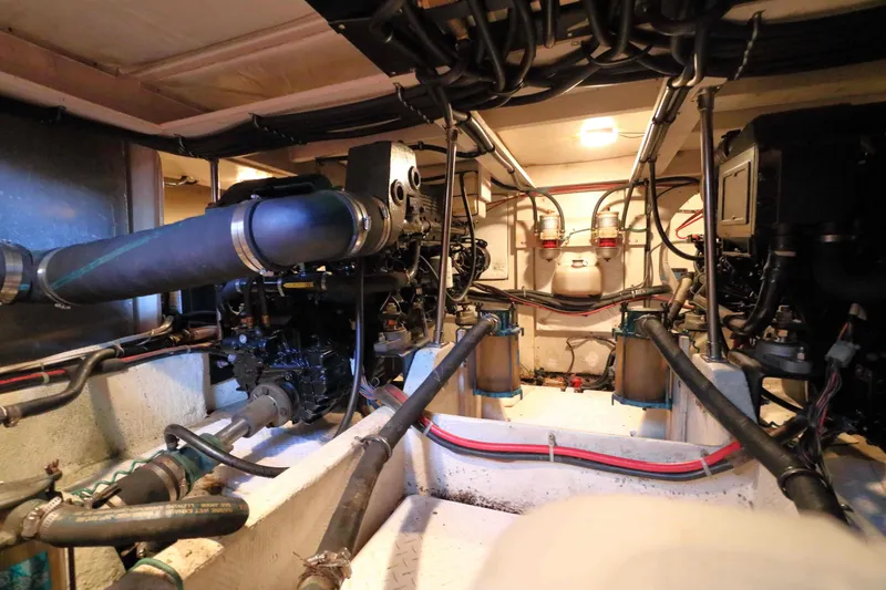 Slide: The Image of Engine room of a 1995 Bayliner 3988 Command Bridge Motoryacht, showcasing mechanical components. - 26