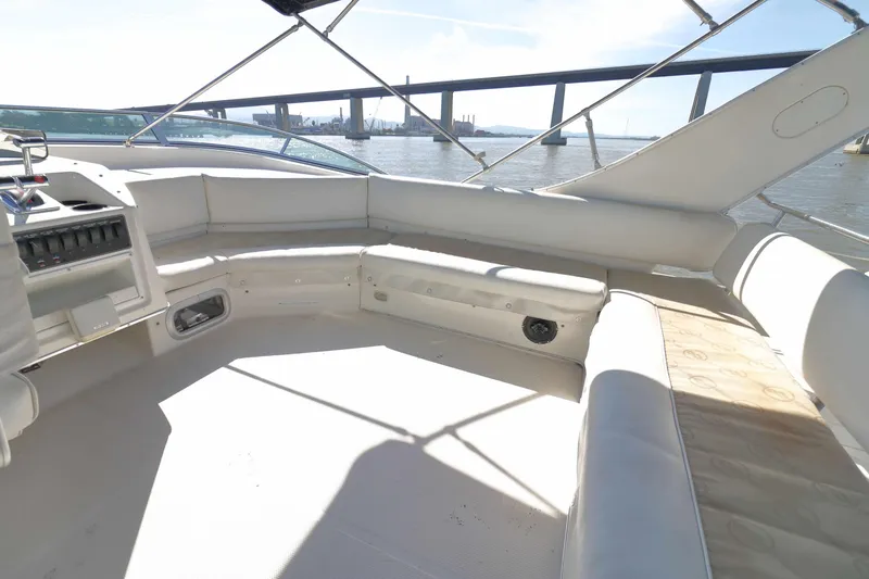 Slide: The Image of 1995 Bayliner 3988 Command Bridge Motoryacht interior with spacious seating and scenic water view. - 4