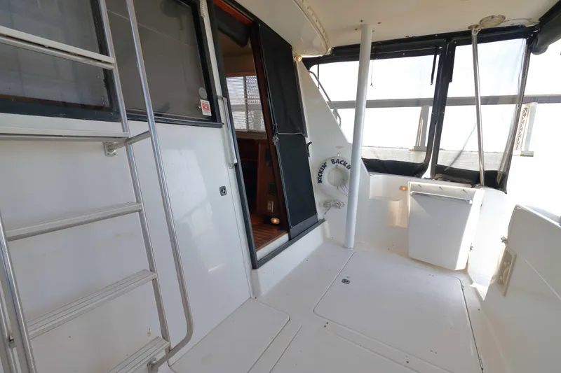 Slide: The Image of 1995 Bayliner 3988 Command Bridge Motoryacht interior with ladder and open door. - 5