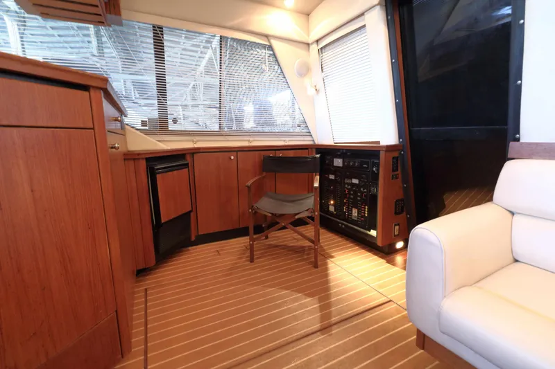 Slide: The Image of Interior of 1995 Bayliner 3988 Command Bridge Motoryacht with wood cabinetry and seating. - 9