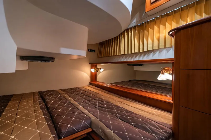 Slide: The Image of Luxurious cabin interior of 2004 Carver 420 Mariner yacht with elegant wood finishes. - 13