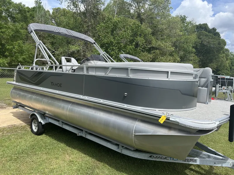 The Image of 2026 Tahoe Pontoon Sport 85 boat on trailer outdoors. - 1