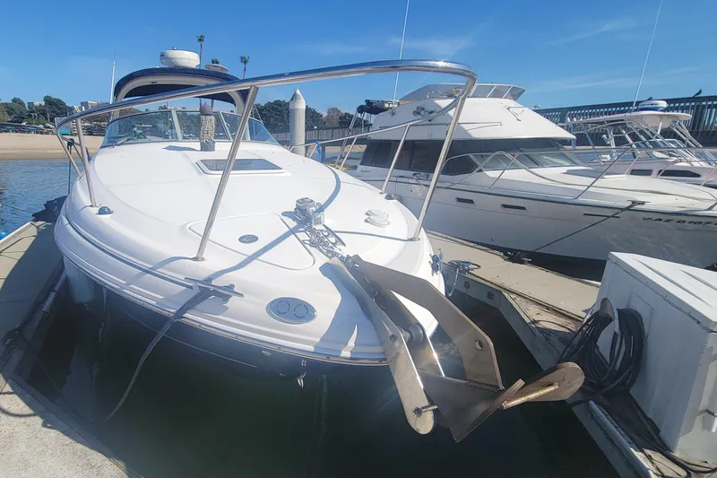 Slide: The Image of 2004 Sea Ray Sundancer 280 docked at marina under clear blue sky. - 15