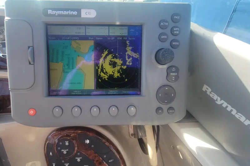 Slide: The Image of Raymarine C70 navigation system on 2004 Sea Ray Sundancer 280 boat dashboard. - 24