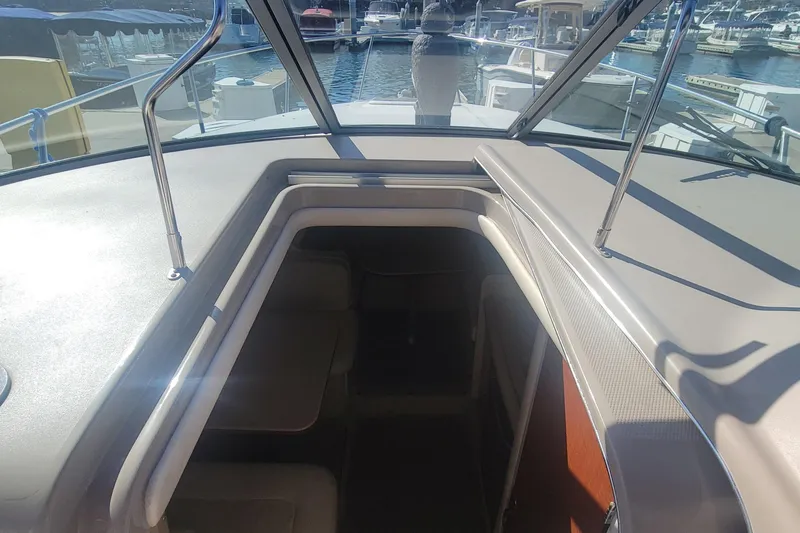 Slide: The Image of 2004 Sea Ray Sundancer 280 cabin entrance with marina view. - 25