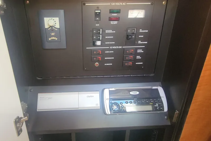Slide: The Image of Electrical control panel and stereo system in 2004 Sea Ray Sundancer 280 boat. - 30