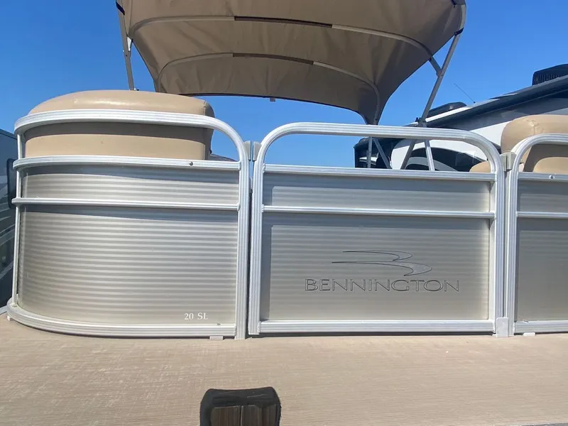 Slide: The Image of Interior of a 2019 Bennington 198SL pontoon boat with beige seating. - 4