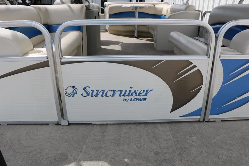 Slide: The Image of 2008 Sun Cruiser SS200 pontoon boat with beige and blue seating, logo visible. - 13