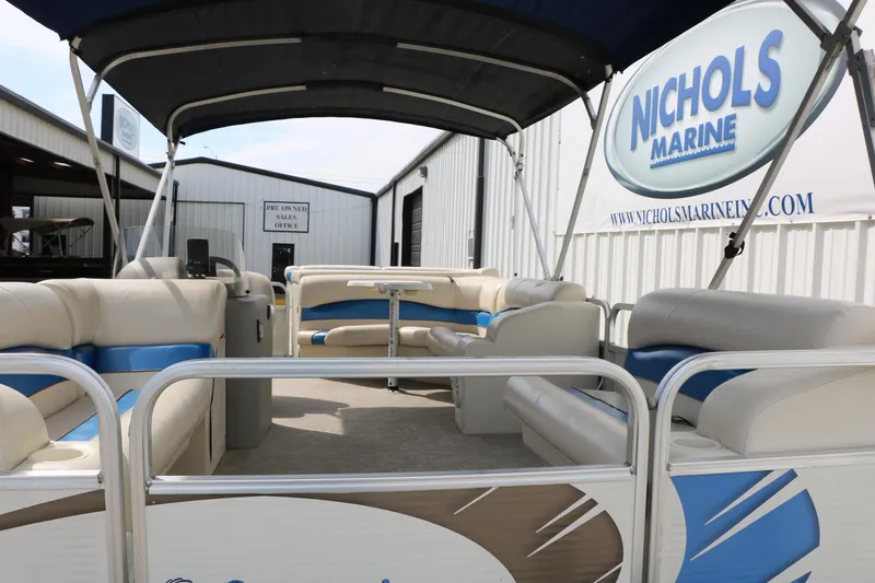 Slide: The Image of 2008 Sun Cruiser SS200 pontoon boat with blue and beige seating at Nichols Marine. - 14