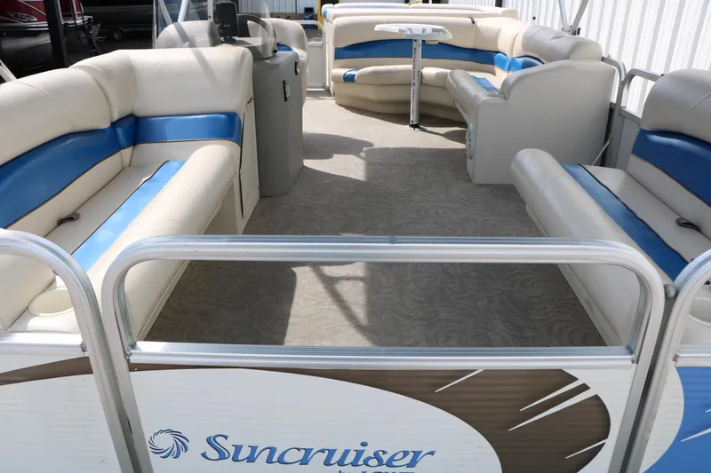 Slide: The Image of 2008 Sun Cruiser SS200 pontoon boat interior with beige and blue seating. - 15
