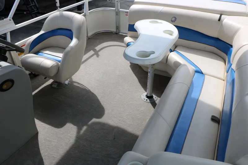Slide: The Image of Interior of 2008 Sun Cruiser SS200 pontoon boat with blue and white seating. - 27