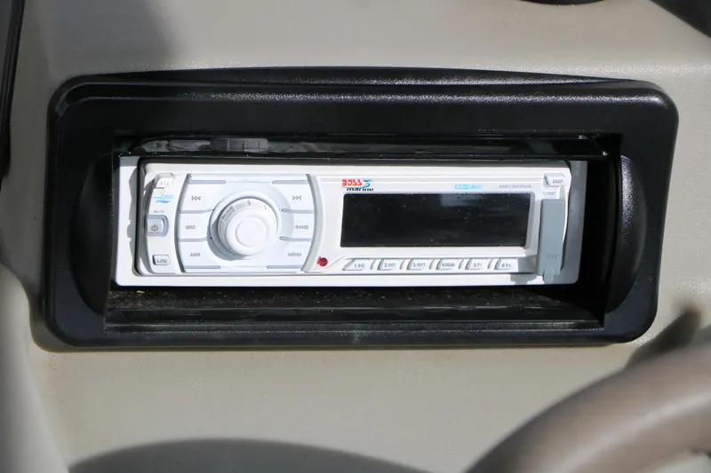 Slide: The Image of 2008 Sun Cruiser SS200 dashboard with a marine stereo system. - 29