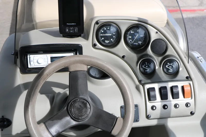 Slide: The Image of Steering console of 2008 Sun Cruiser SS200 boat with gauges and controls. - 31