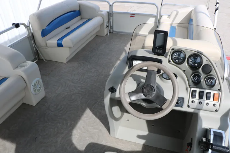 Slide: The Image of Interior of 2008 Sun Cruiser SS200 pontoon boat with steering console and seating. - 32