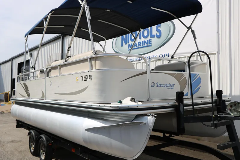 Slide: The Image of 2008 Sun Cruiser SS200 pontoon boat on trailer at Nichols Marine dealership. - 33