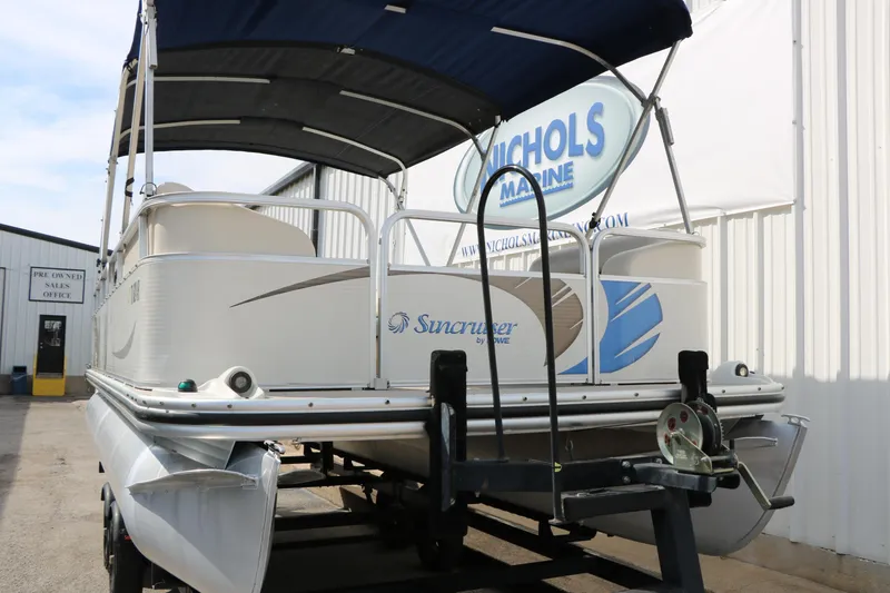 Slide: The Image of 2008 Sun Cruiser SS200 pontoon boat on trailer at Nichols Marine dealership. - 34