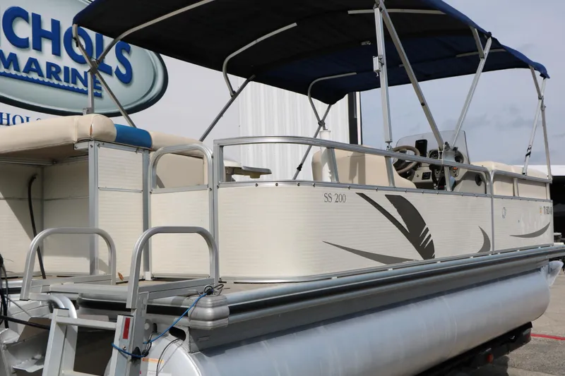 Slide: The Image of 2008 Sun Cruiser SS200 pontoon boat with canopy at Nichols Marine dealership. - 5