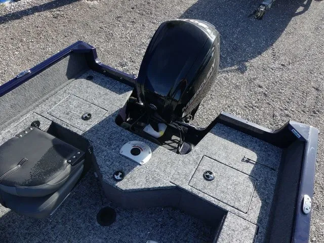 Slide: The Image of Tracker Pro Guide V-16 SC 2026 with outboard motor on gravel surface. - 14