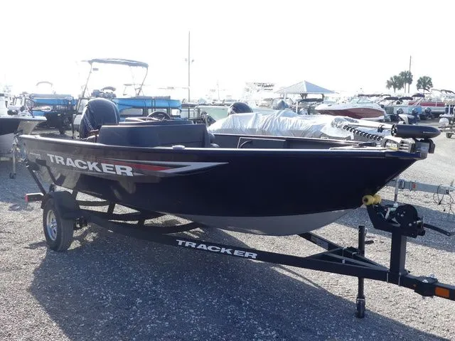 Slide: The Image of 2026 Tracker Pro Guide V-16 SC boat on trailer outdoors. - 3