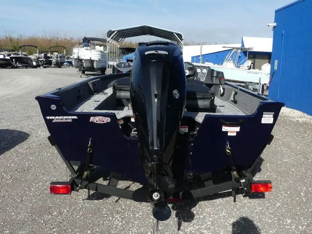 Slide: The Image of 2026 Tracker Pro Guide V-16 SC boat on trailer outdoors. - 5