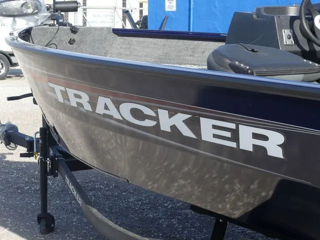 Slide: The Image of 2026 Tracker Pro Guide V-16 SC boat side view on trailer. - 7