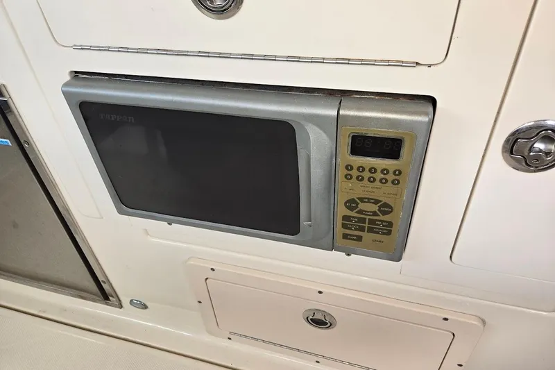 Slide: The Image of Built-in microwave on 2009 Mainship Pilot 31 boat interior. - 38