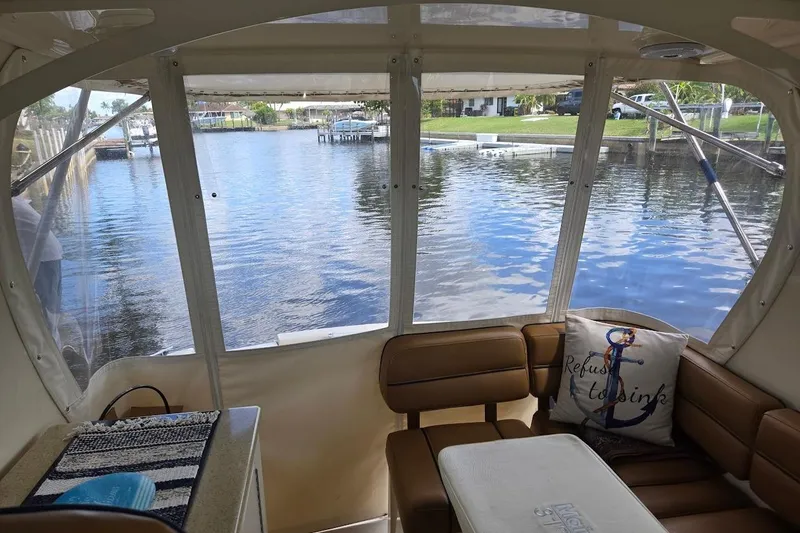 Slide: The Image of Interior view of 2009 Mainship Pilot 31 boat with waterfront scenery. - 39