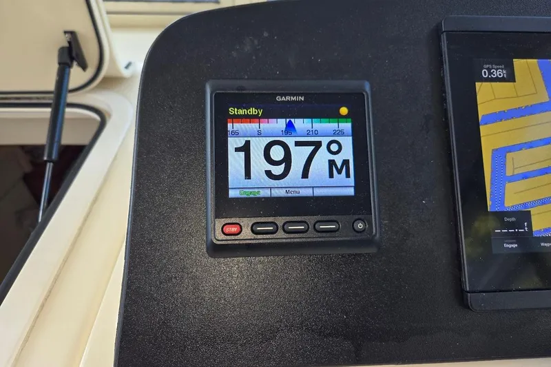 Slide: The Image of Garmin navigation display on 2009 Mainship Pilot 31 boat dashboard. - 42